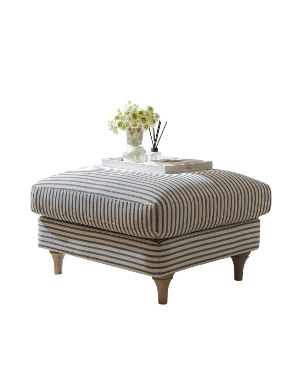 upholstered footstool with turned legs in blue by Daals