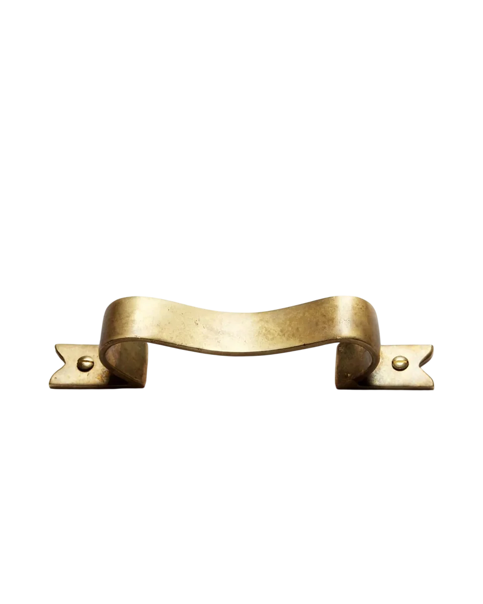 brass ribbon handle by Beata Heuman