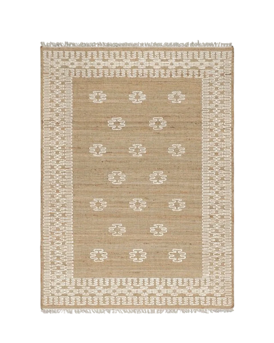 hand-stitched jute rug with woven border in natural by Birdie Fortescue