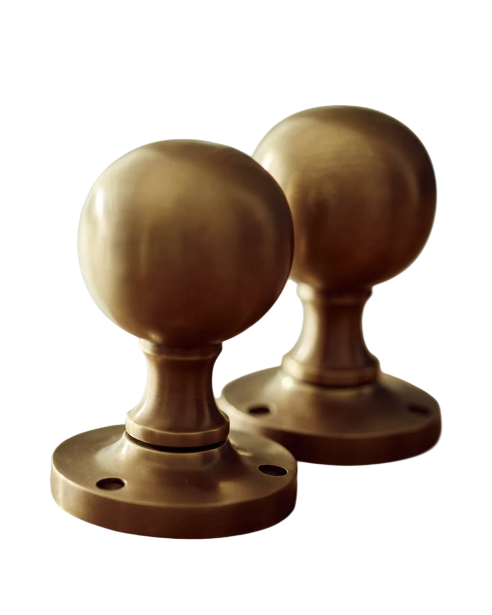 antique brass spherical door knobs by Rowen and Wren