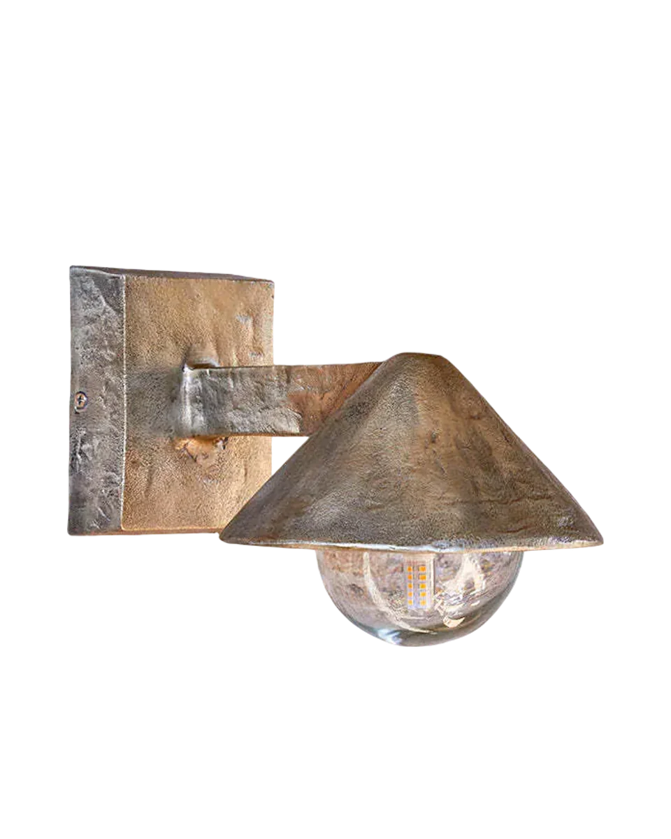 antique brass outdoor wall lamp in yellow by Nkuku
