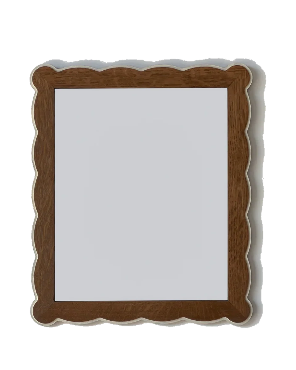 scalloped wooden mirror with bobbin trim