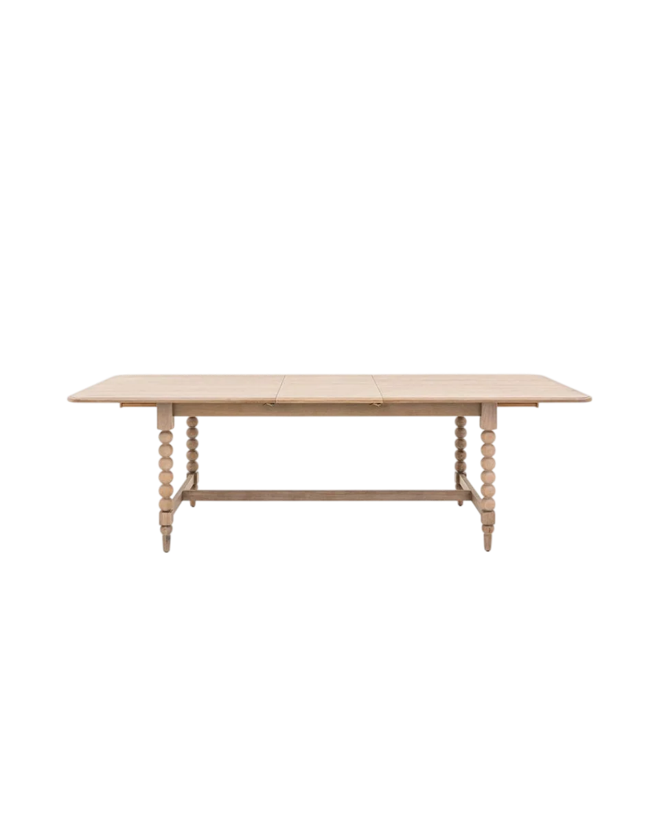 extending wooden dining table with bobbin legs in brown by Perch & Parrow