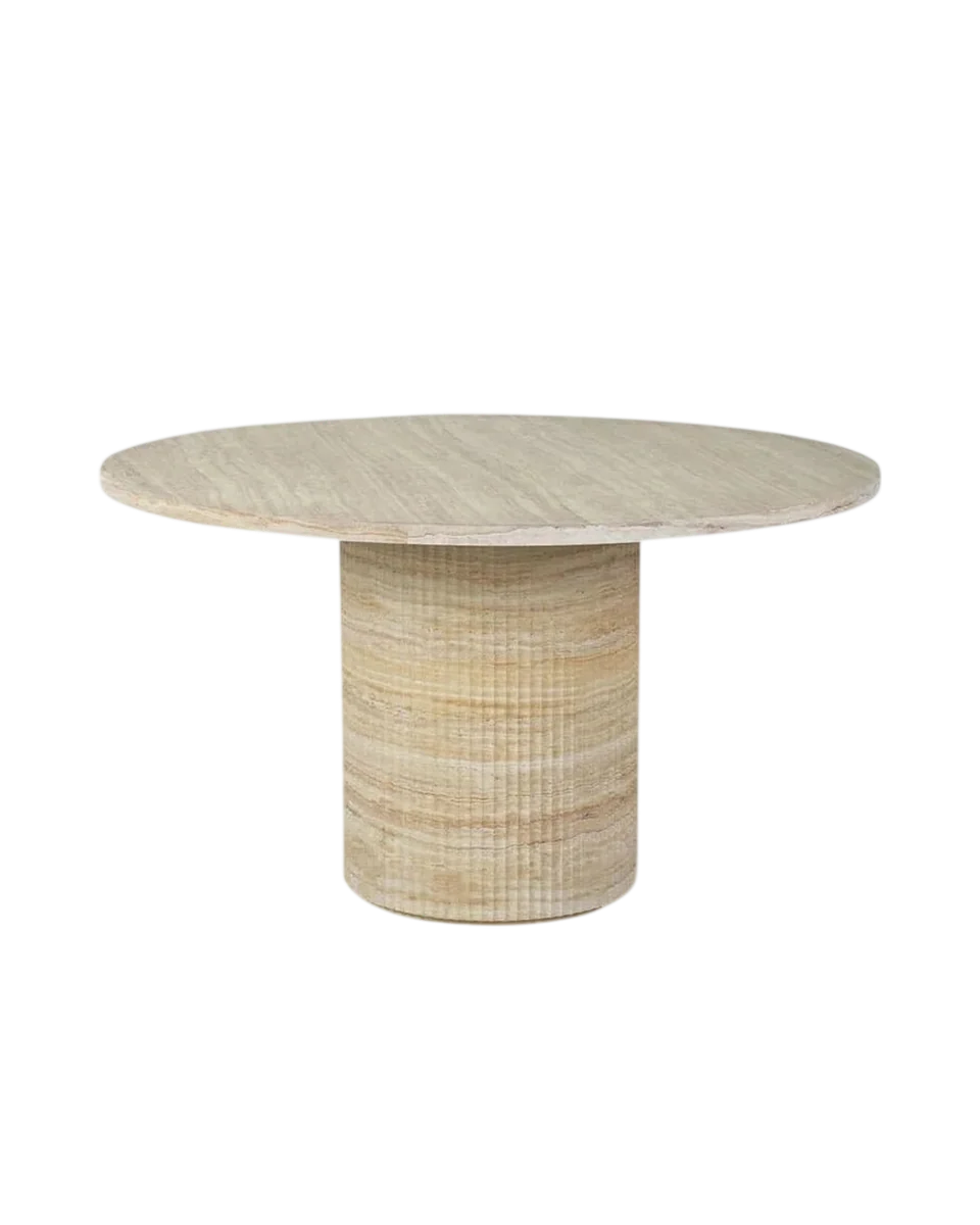 faux travertine dining table by Abigail Ahern