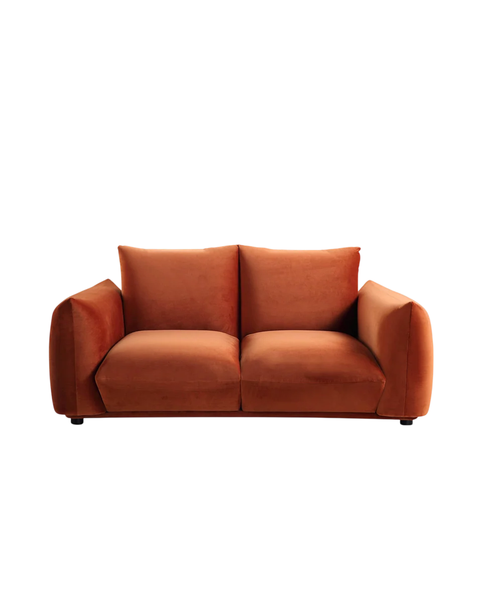 curved low two seater sofa in rust by Daals